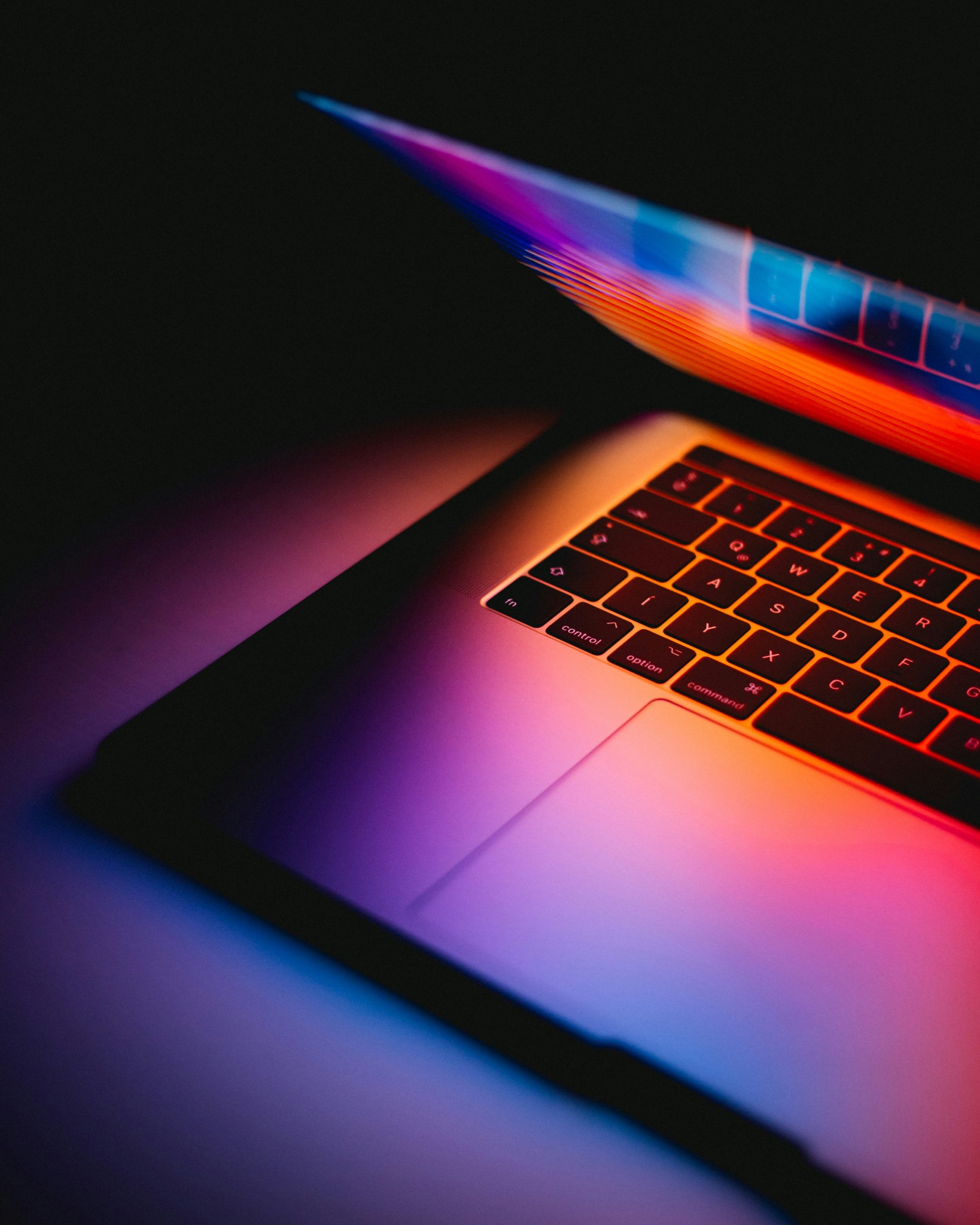 Laptop illuminated by focused lines of light